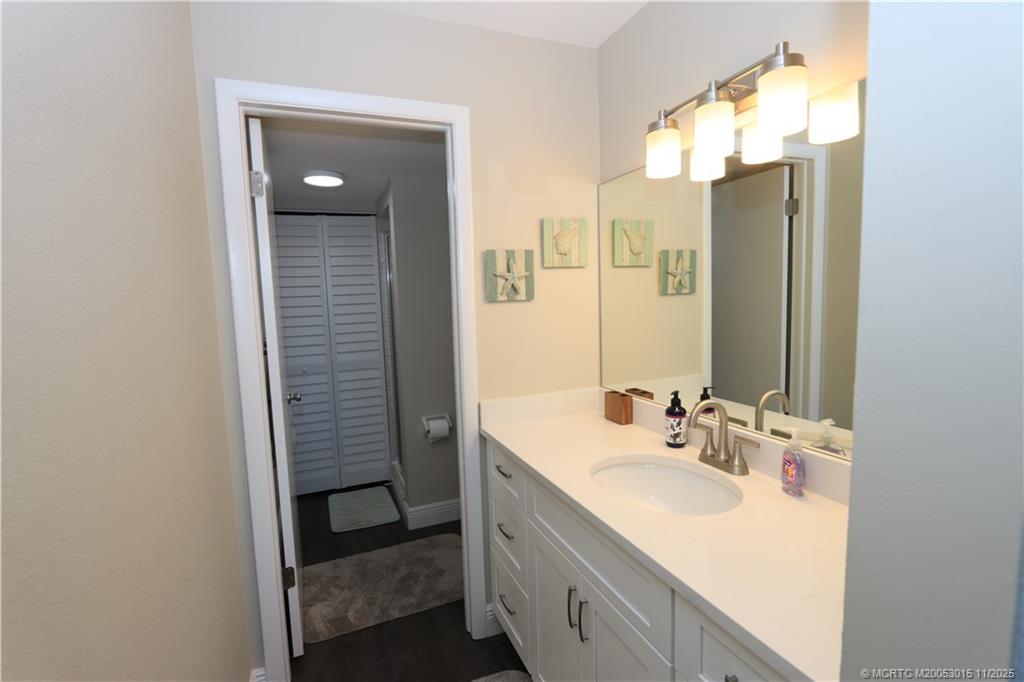 7380 South Ocean Drive, Unit 621 Jensen Beach, FL 34957 - Photo 28 of 48 a bathroom with a sink and a mirror