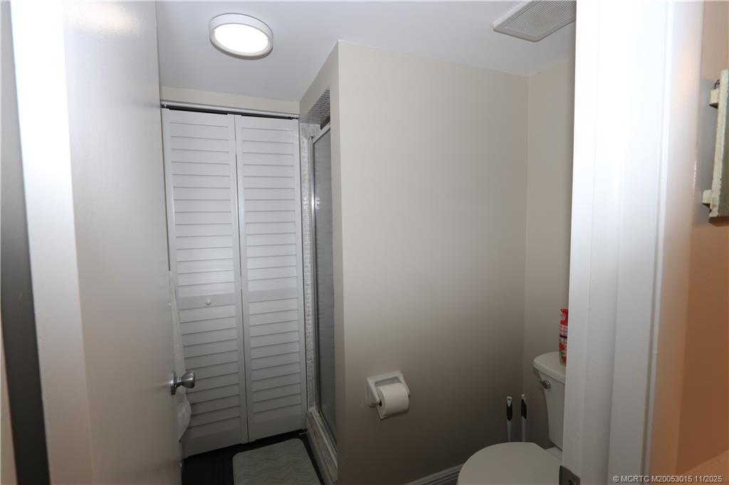 7380 South Ocean Drive, Unit 621 Jensen Beach, FL 34957 - Photo 29 of 48 a bathroom with a toilet and a shower
