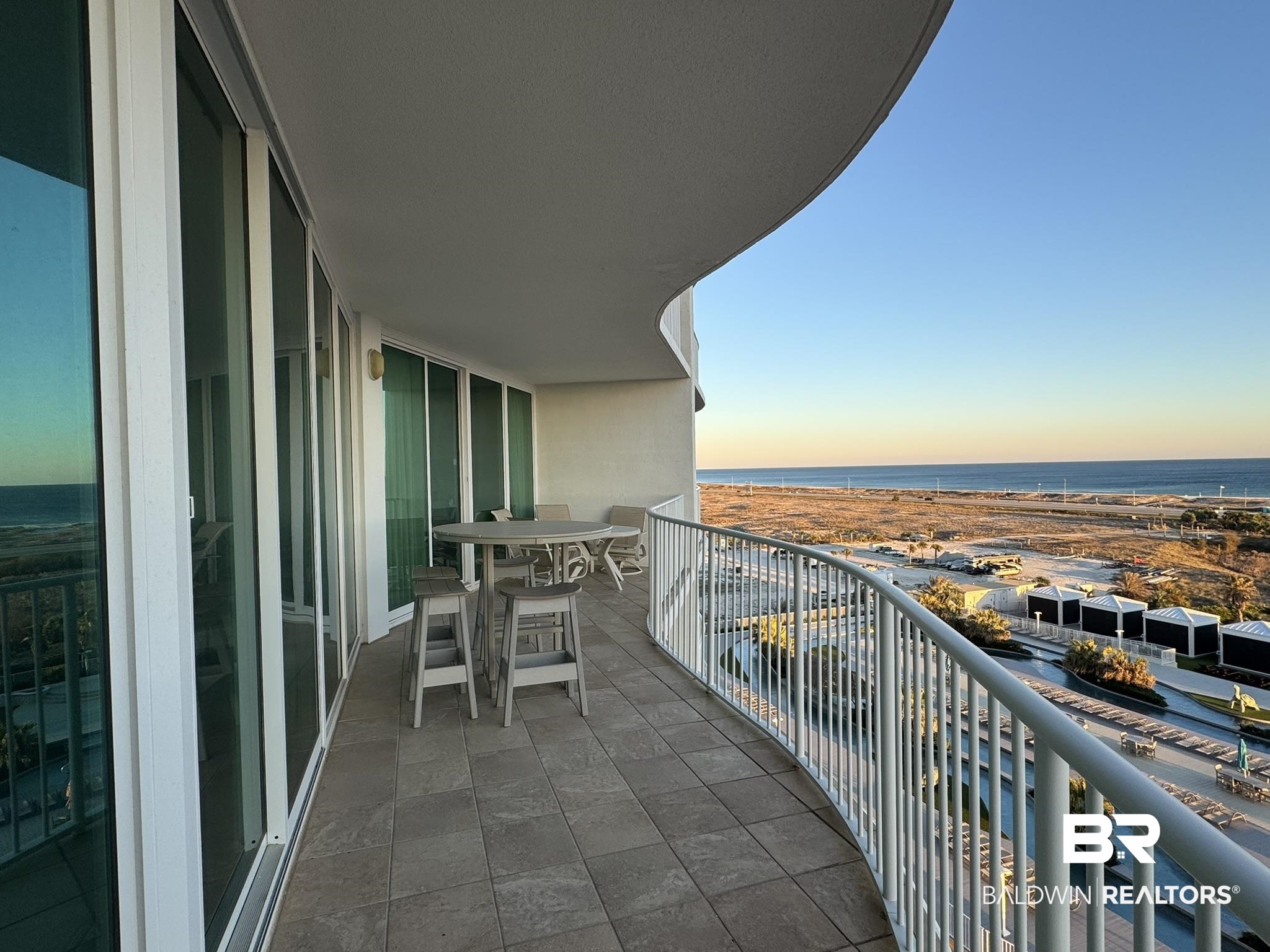 28107 Perdido Beach Boulevard, Unit D714 Orange Beach, AL 36561 - Photo 45 of 88 Balcony at dusk featuring a water view