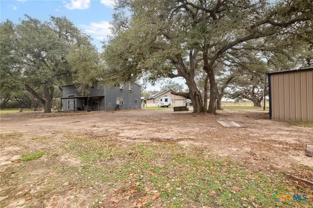 a view of open space with yard