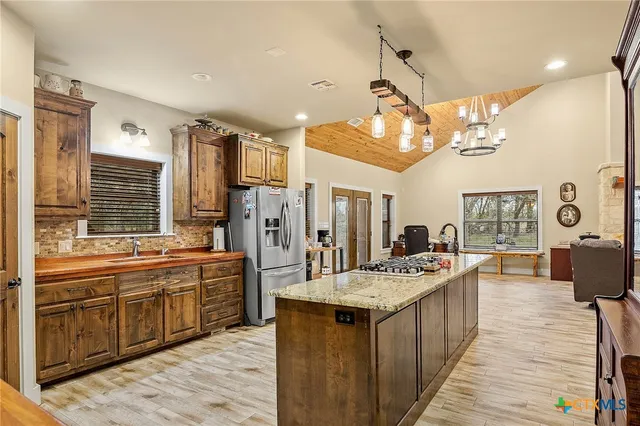 a kitchen with a sink and a window