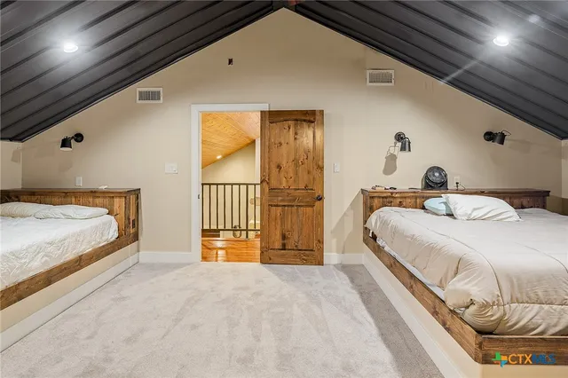 a view of a kitchen with furniture and a ceiling fan