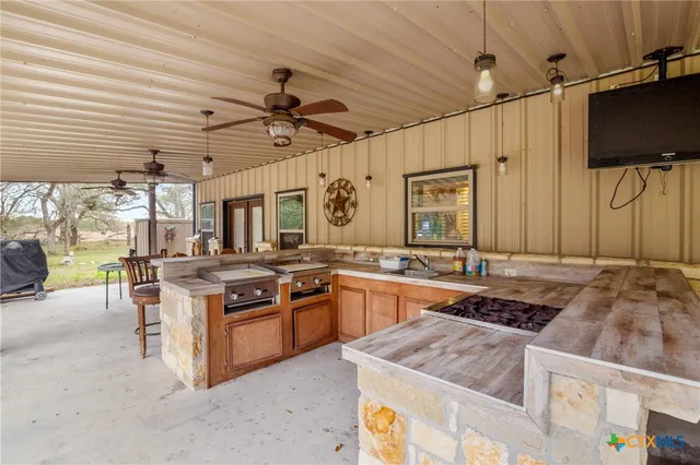 a kitchen with a stove and a refrigerator