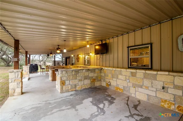 a kitchen with stainless steel appliances granite countertop a stove and a wooden floors