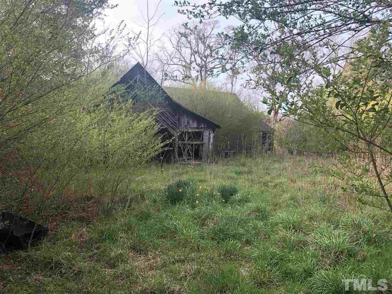 400 Lanes Mill Road Bennett, NC 27208 - Photo 5 of 6 a backyard of a house with lots of green space