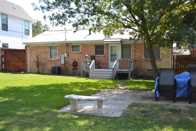 a front view of house with a garden and patio