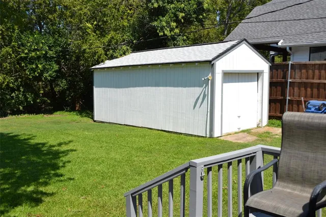 a house with green field in front of it