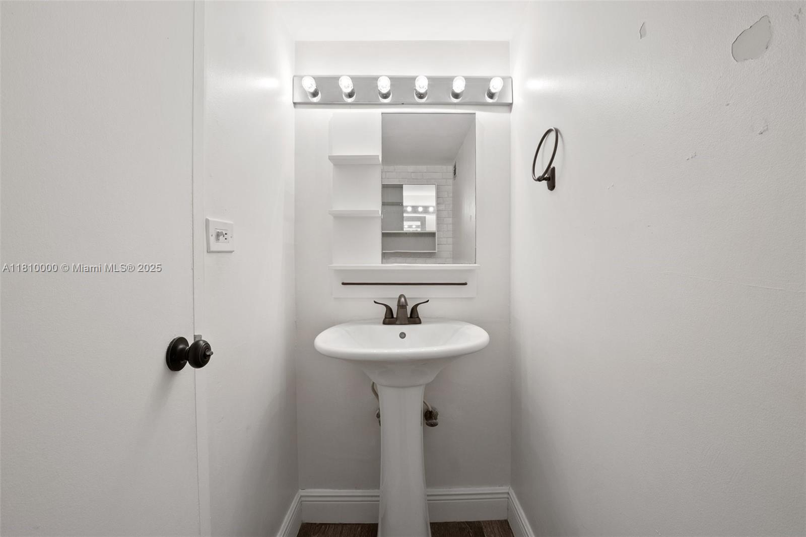 150 Southeast 25th Road, Unit 10K Miami, FL 33129 - Photo 18 of 43 a bathroom with a sink a mirror and shower