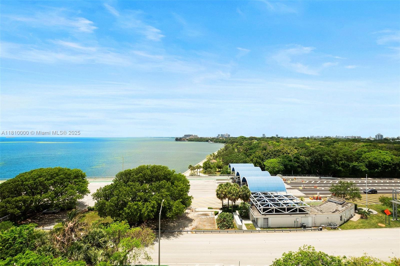150 Southeast 25th Road, Unit 10K Miami, FL 33129 - Photo 23 of 43 a view of a lake with houses in the back