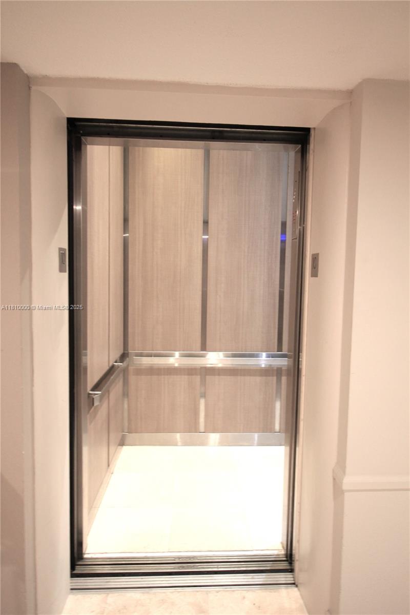 150 Southeast 25th Road, Unit 10K Miami, FL 33129 - Photo 27 of 43 a bathroom with a glass shower door