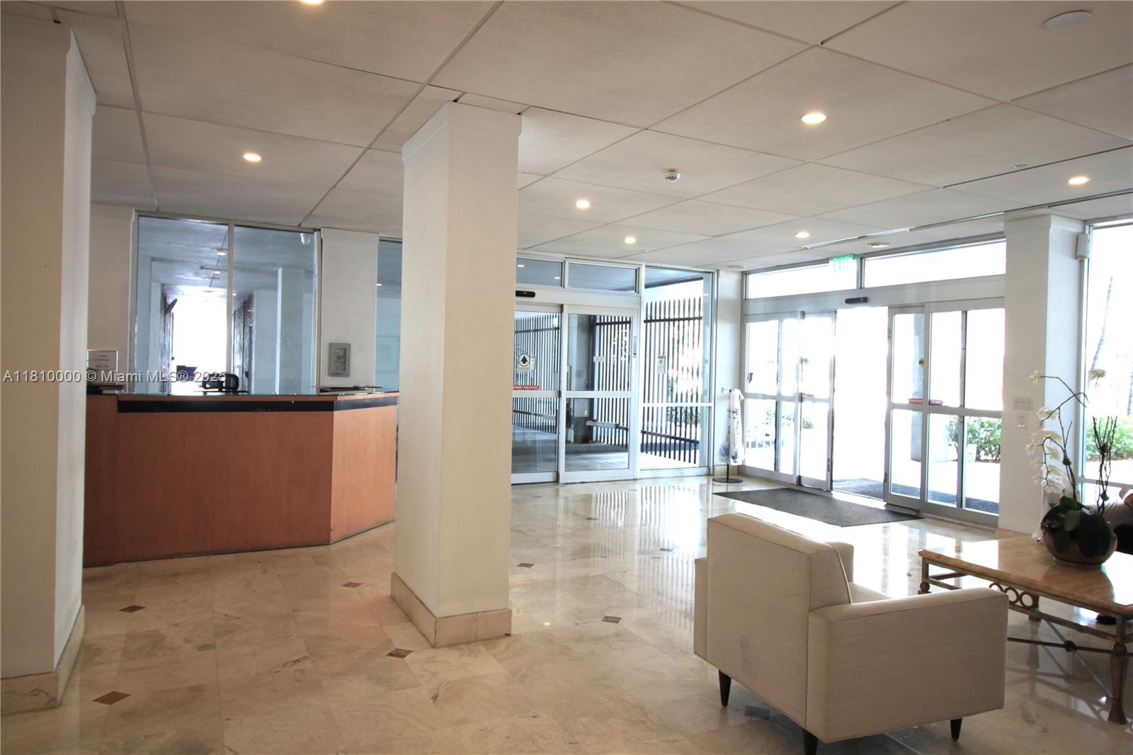 150 Southeast 25th Road, Unit 10K Miami, FL 33129 - Photo 30 of 43 a living room with furniture and large windows