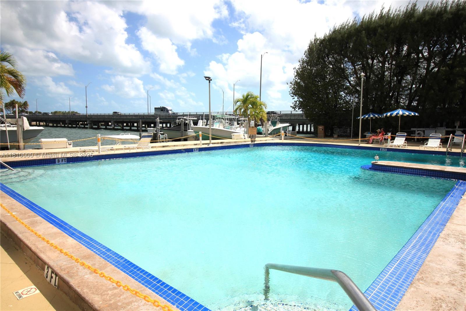 150 Southeast 25th Road, Unit 10K Miami, FL 33129 - Photo 33 of 43 a view of outdoor space with swimming pool and furniture