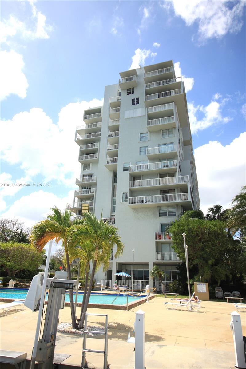 150 Southeast 25th Road, Unit 10K Miami, FL 33129 - Photo 35 of 43 a view of a tall building with a yard