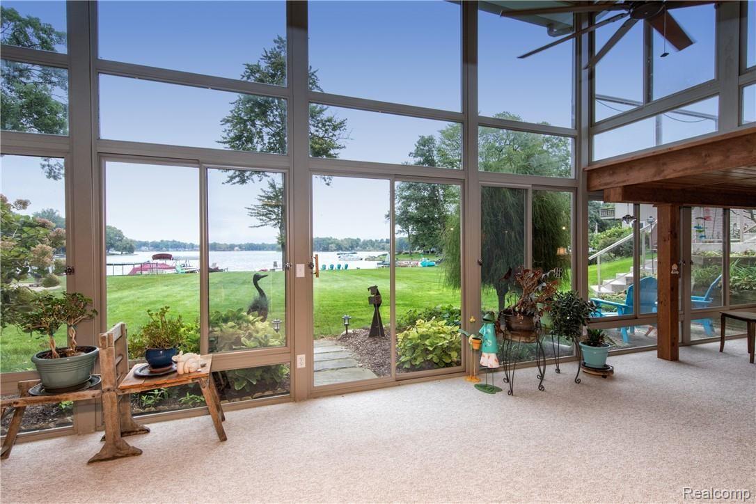 7272 Hatchery Road Waterford, MI 48327 - Photo 31 of 46 OVER 500 square feet of living space in this two story atrium! Fit with walkout and truly breathtaking views!