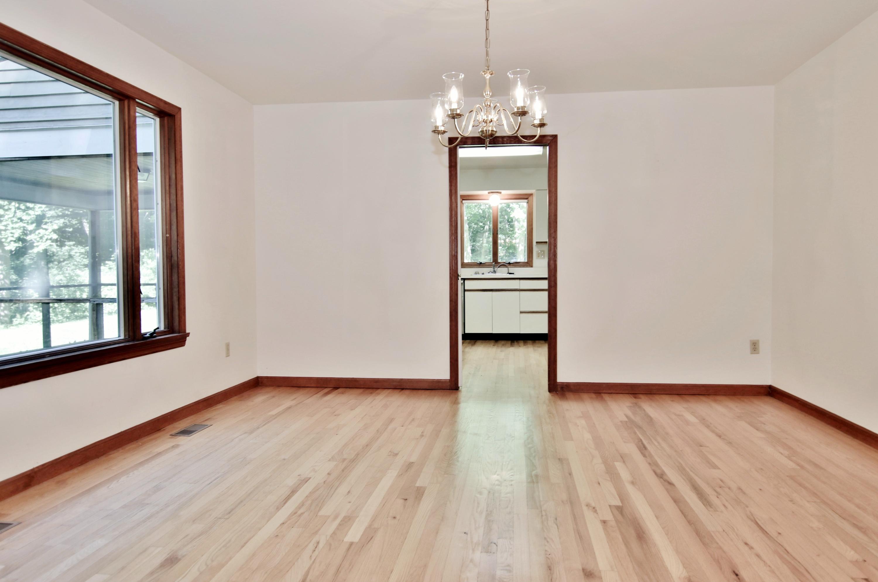838 Valley Road New Canaan, CT 06840 - Photo 12 of 44 a view of empty room with wooden floor and fan