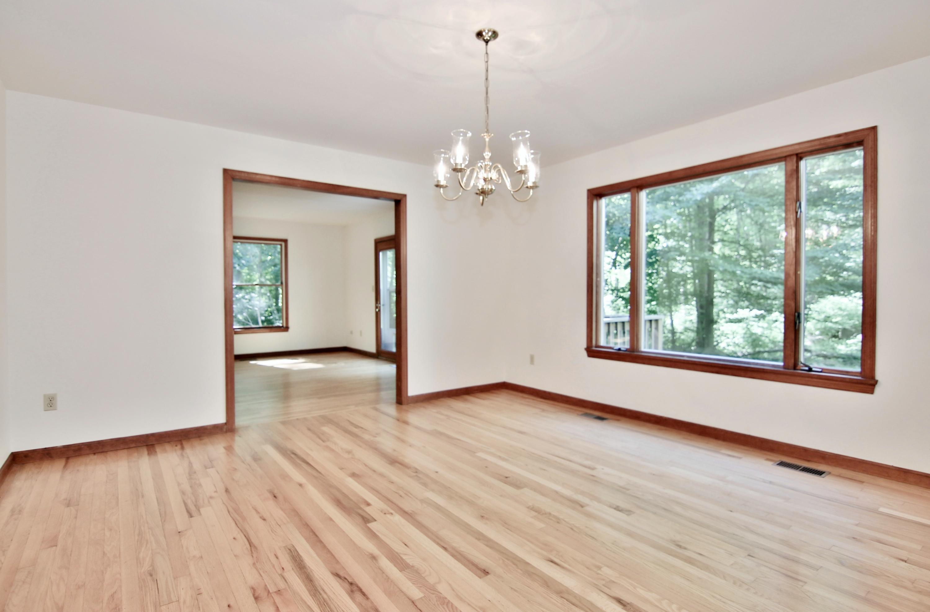 838 Valley Road New Canaan, CT 06840 - Photo 13 of 44 a view of an empty room with wooden floor and a window