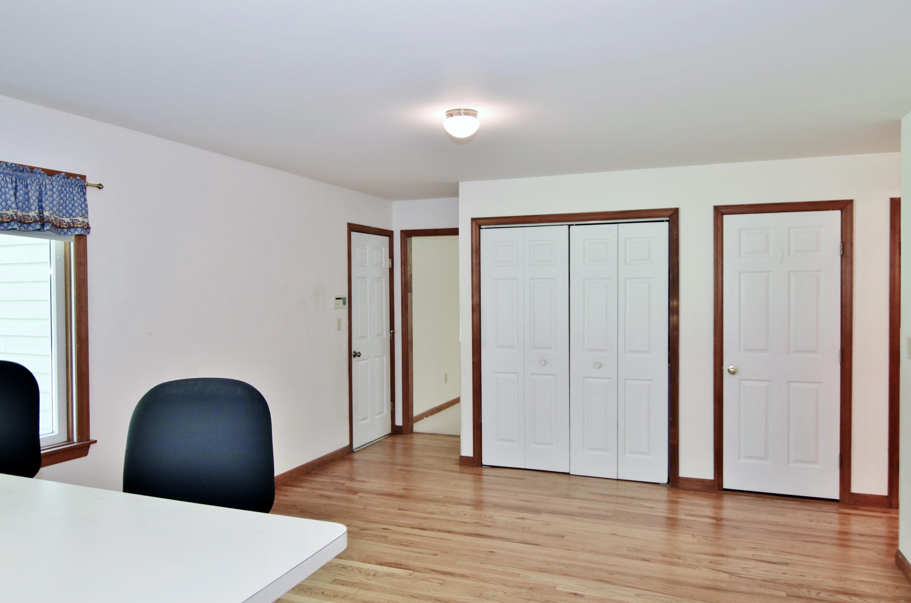 838 Valley Road New Canaan, CT 06840 - Photo 18 of 44 a view of a livingroom with wooden floor and furniture