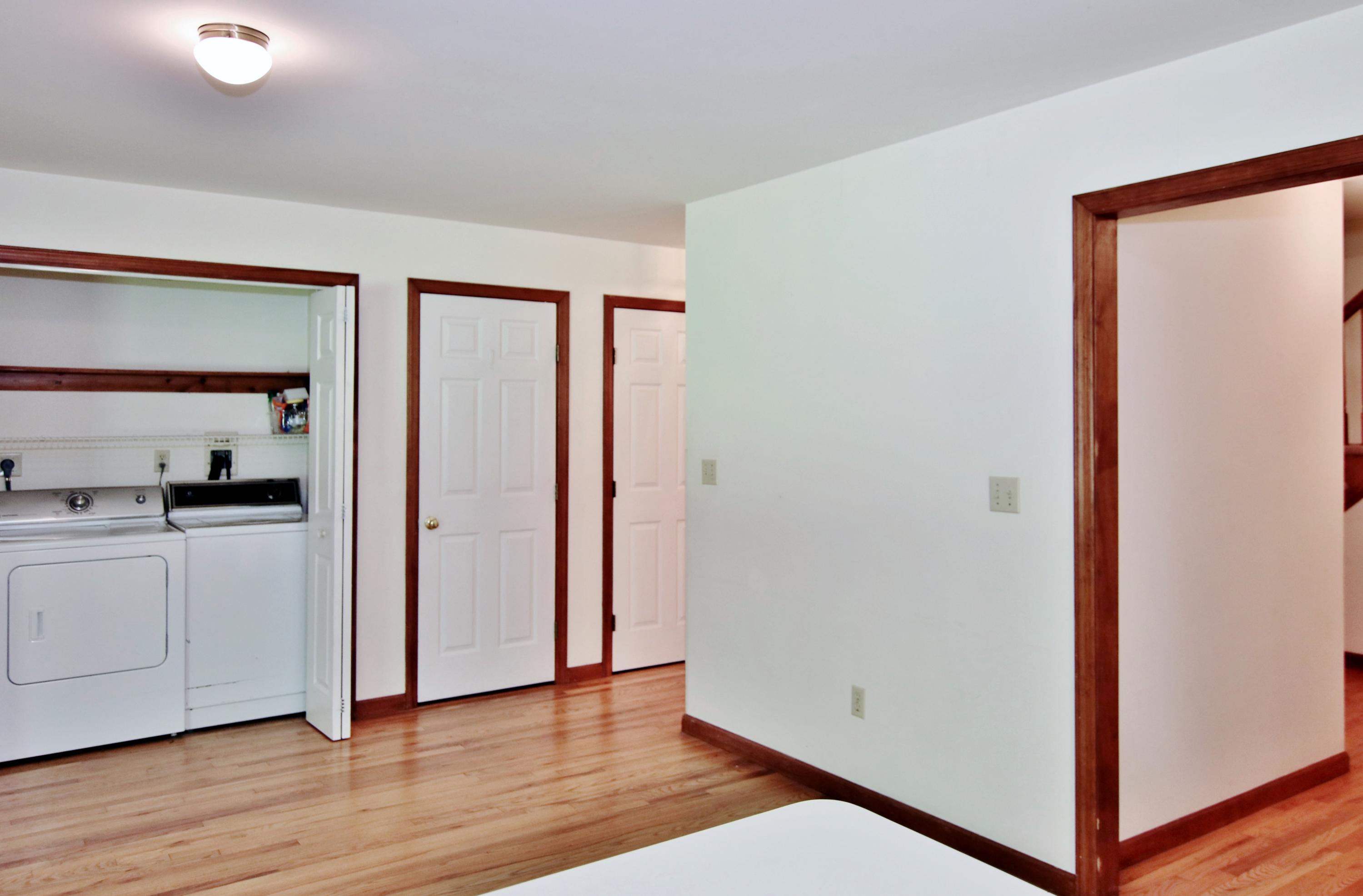 838 Valley Road New Canaan, CT 06840 - Photo 19 of 44 a view of a hallway with wooden floor and closet