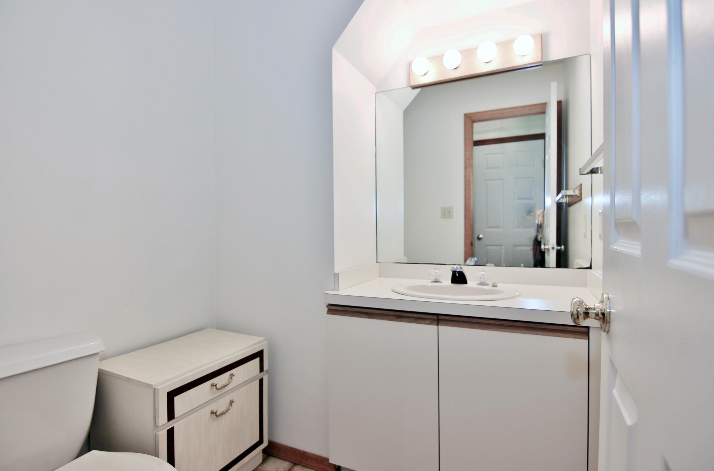 838 Valley Road New Canaan, CT 06840 - Photo 20 of 44 a bathroom with a sink and a mirror