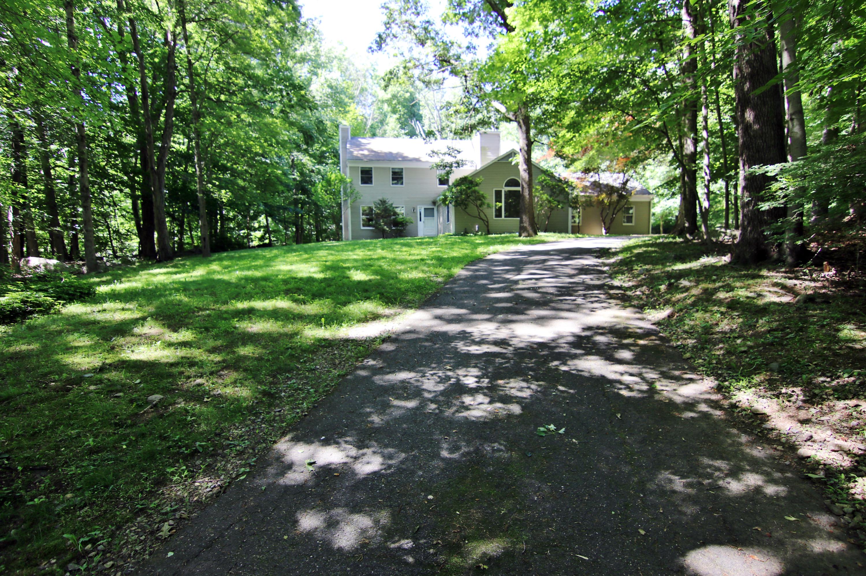 838 Valley Road New Canaan, CT 06840 - Photo 3 of 44 a view of a house with a yard