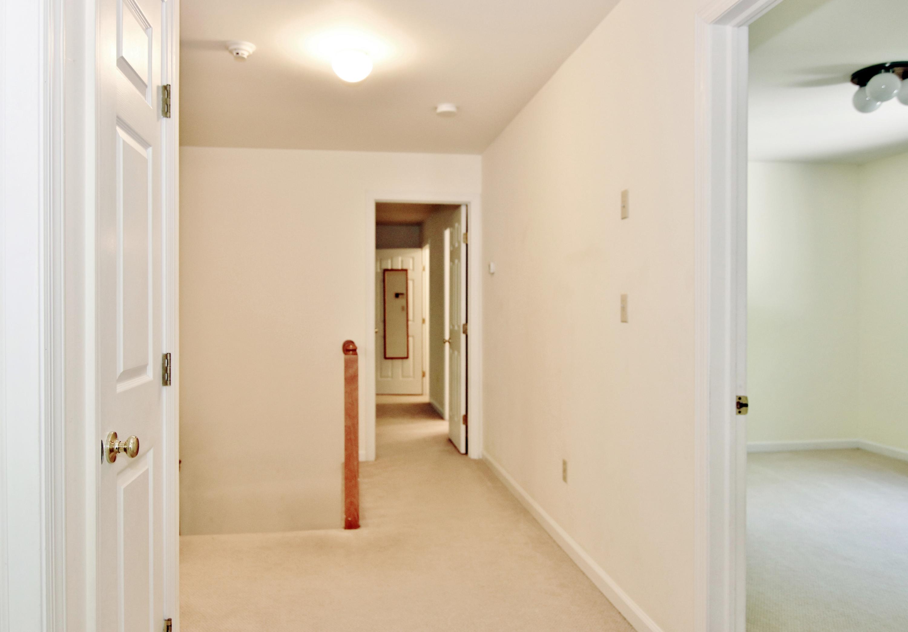 838 Valley Road New Canaan, CT 06840 - Photo 27 of 44 a view of a hallway with wooden shelves