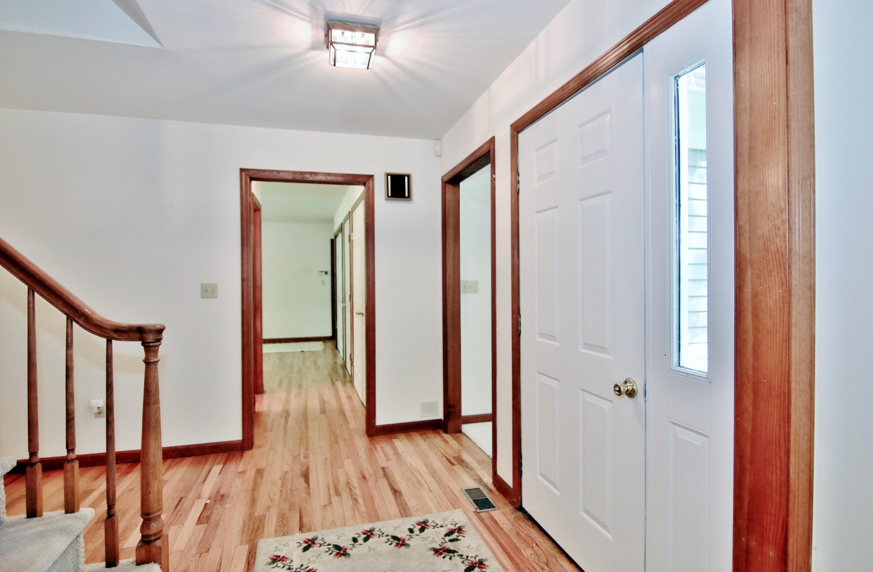 838 Valley Road New Canaan, CT 06840 - Photo 4 of 44 a view of entryway with wooden floor