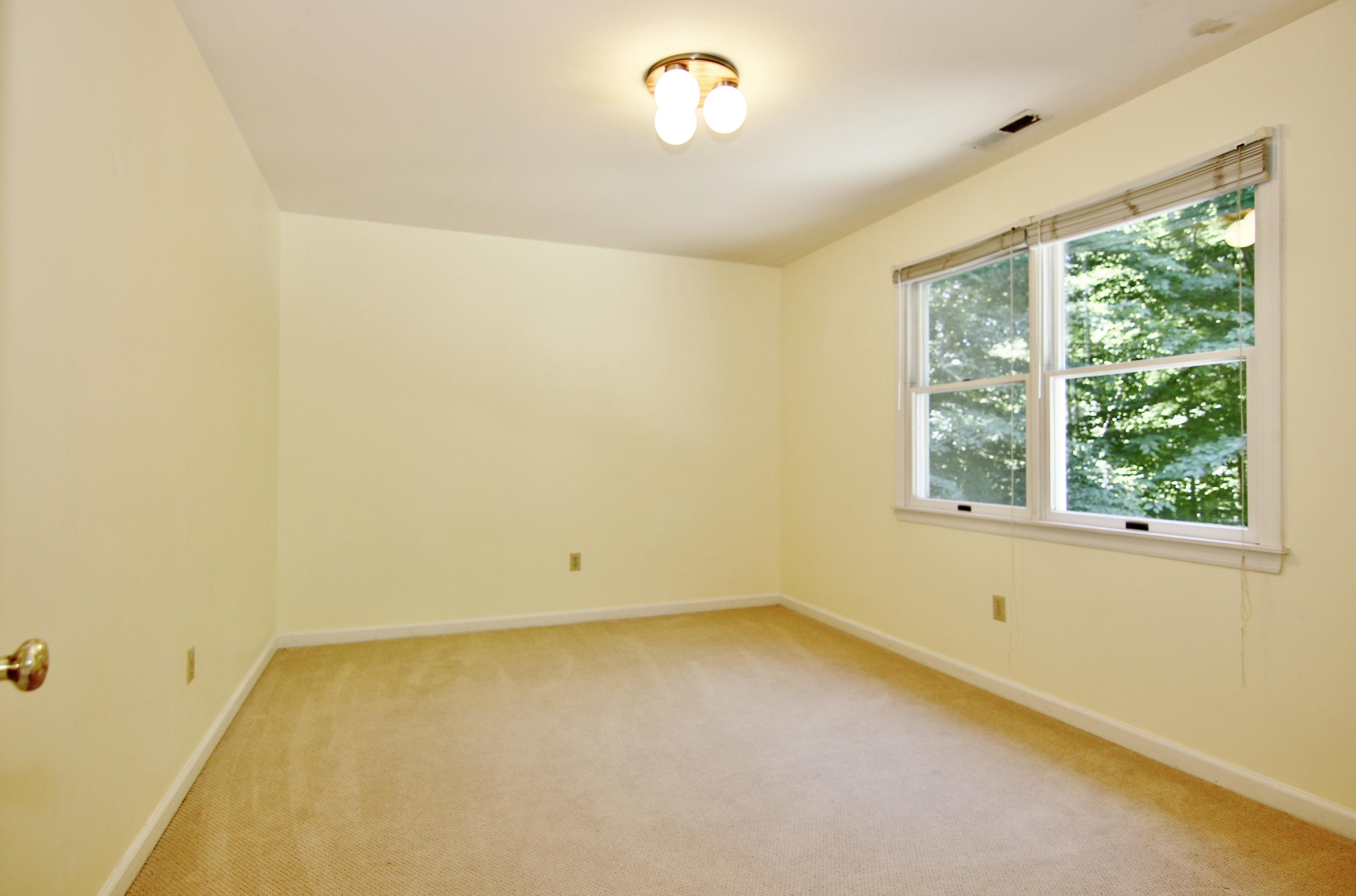 838 Valley Road New Canaan, CT 06840 - Photo 32 of 44 an empty room with a window