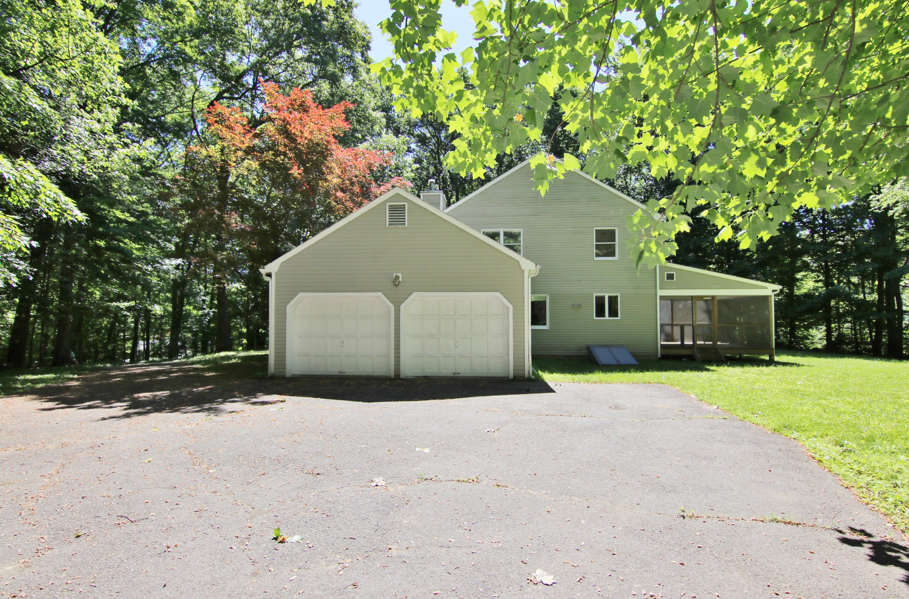838 Valley Road New Canaan, CT 06840 - Photo 39 of 44 a house that has a tree in front of it