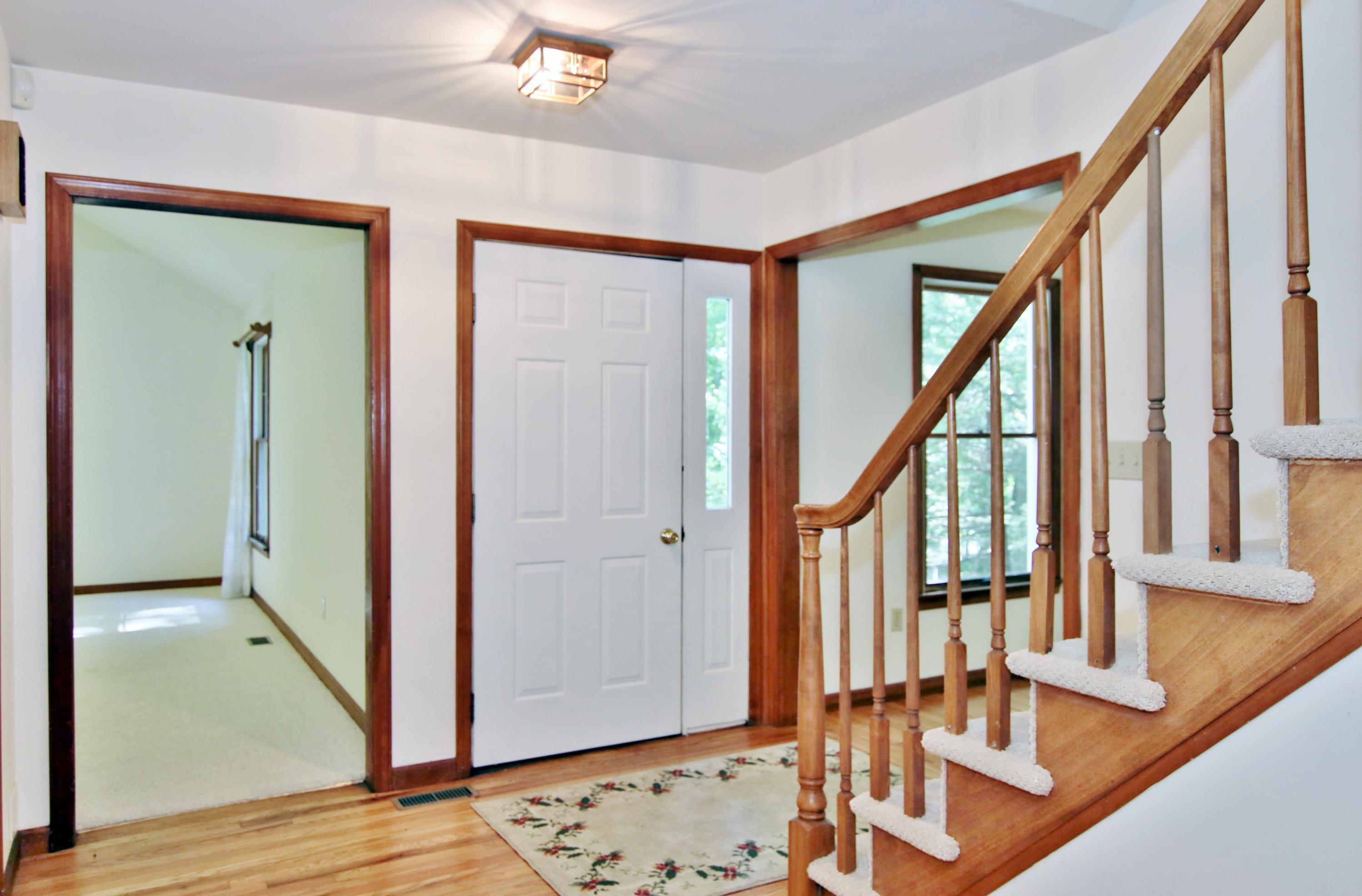 838 Valley Road New Canaan, CT 06840 - Photo 5 of 44 a view of an entryway with wooden floor and door