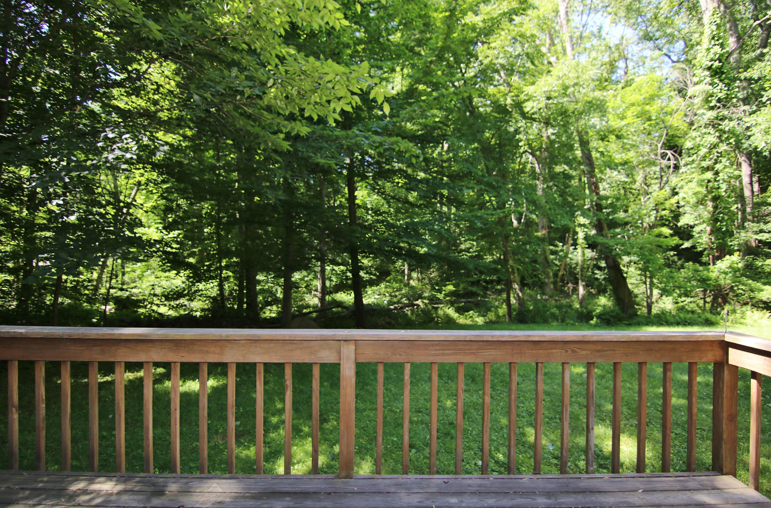 838 Valley Road New Canaan, CT 06840 - Photo 44 of 44 a view of a wooden fence