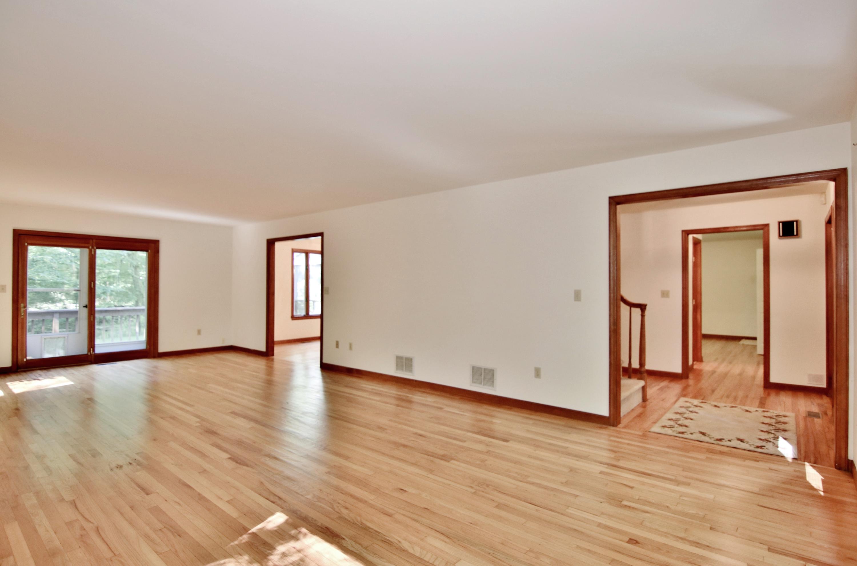 838 Valley Road New Canaan, CT 06840 - Photo 7 of 44 a view of an empty room with wooden floor and a window