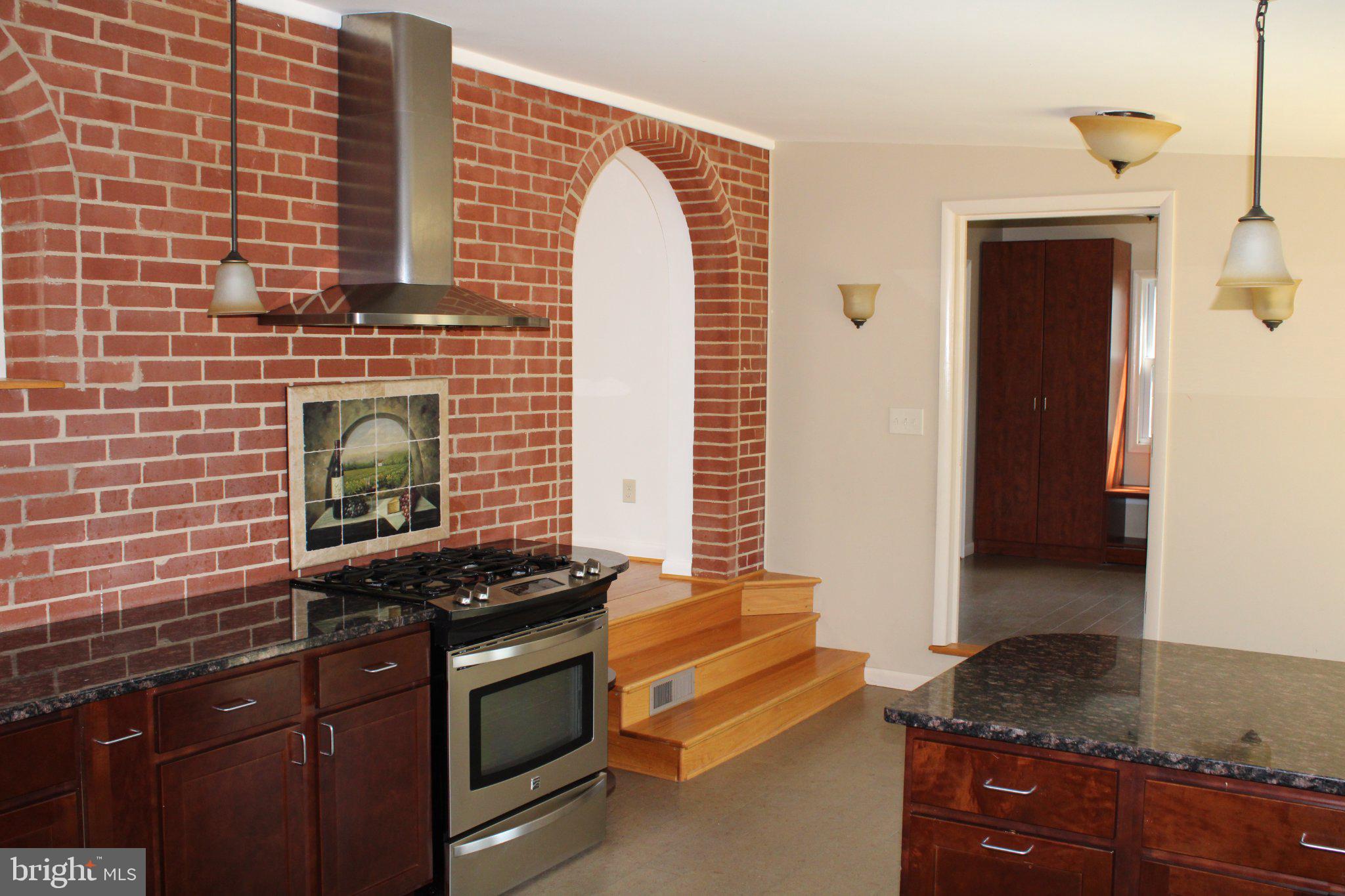 6809 Ruskin Street Springfield, VA 22150 - Photo 20 of 39 Charming kitchen with rustic brick accents.