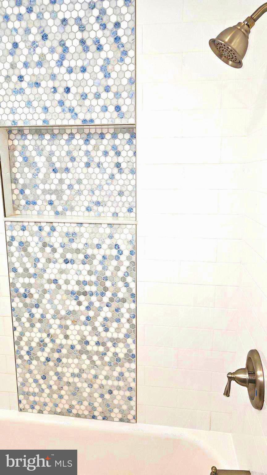 6809 Ruskin Street Springfield, VA 22150 - Photo 27 of 39 Elegant hexagonal tile design in bath.