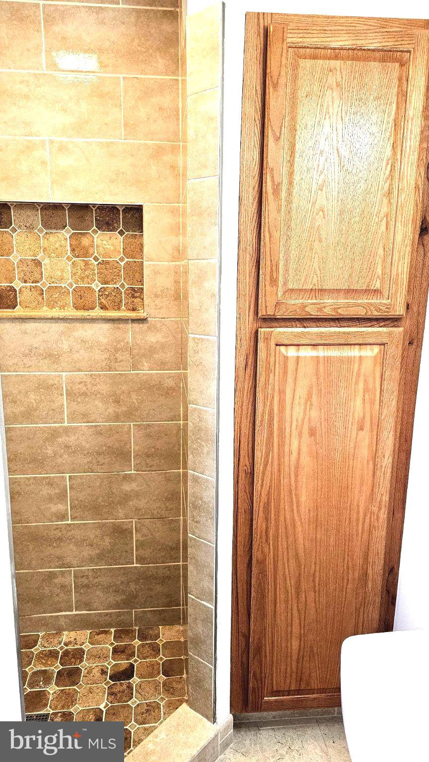 6809 Ruskin Street Springfield, VA 22150 - Photo 28 of 39 Stylish shower with elegant tile work.
