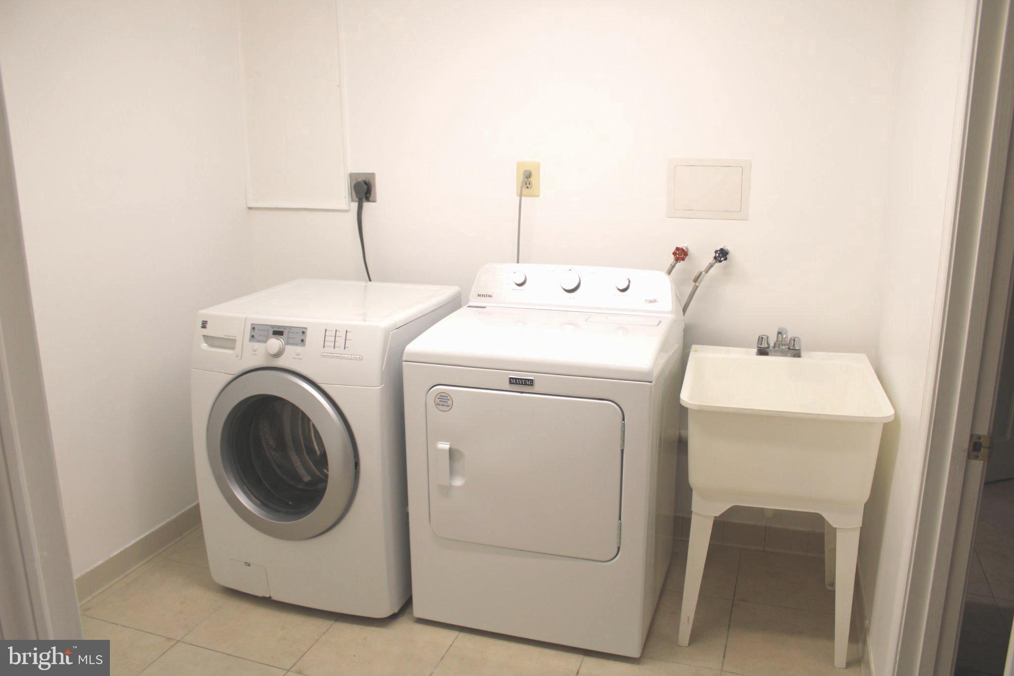 6809 Ruskin Street Springfield, VA 22150 - Photo 37 of 39 Modern laundry space with sleek appliances.