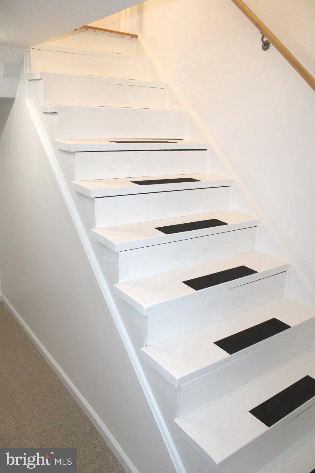 6809 Ruskin Street Springfield, VA 22150 - Photo 39 of 39 Sleek white staircase with modern accents.