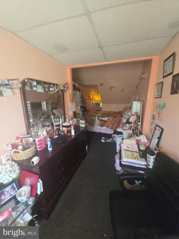 a room with furniture and gym equipment