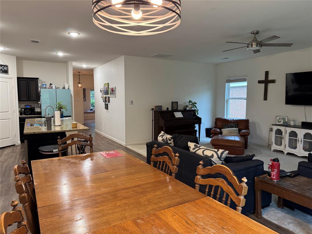 2209 Cinnamon Spgs Road Glenn Heights, TX 75154 - Photo 15 of 28 Spacious dining area featuring wood-finish flooring and a contemporary overhead light fixture