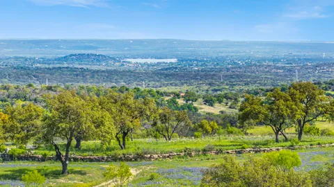 a view of a lake with a big yard