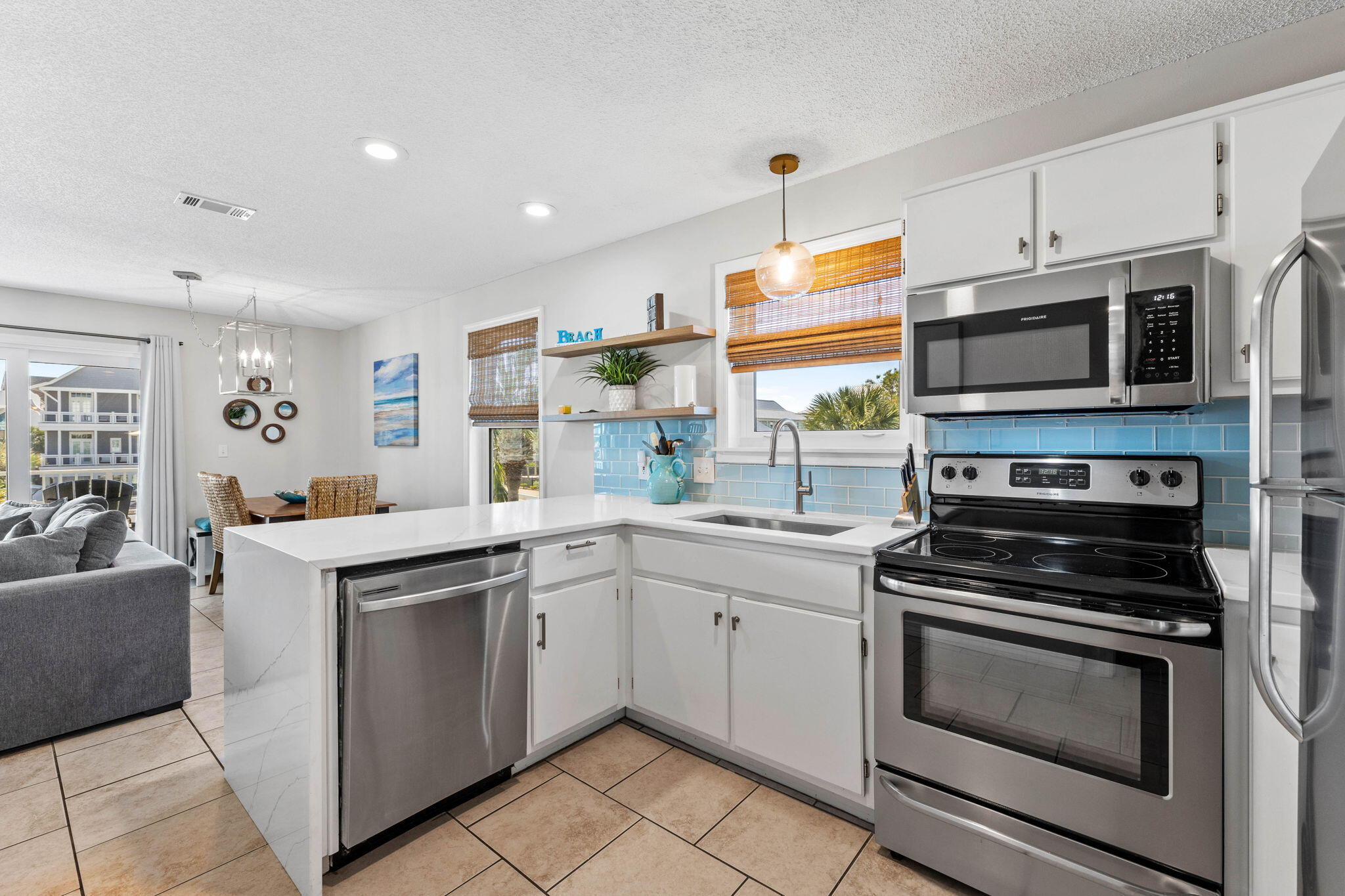 11 Beachside Drive, Unit 1121 Santa Rosa Beach, FL 32459 - Photo 11 of 43 a kitchen with cabinets stainless steel appliances and wooden floor