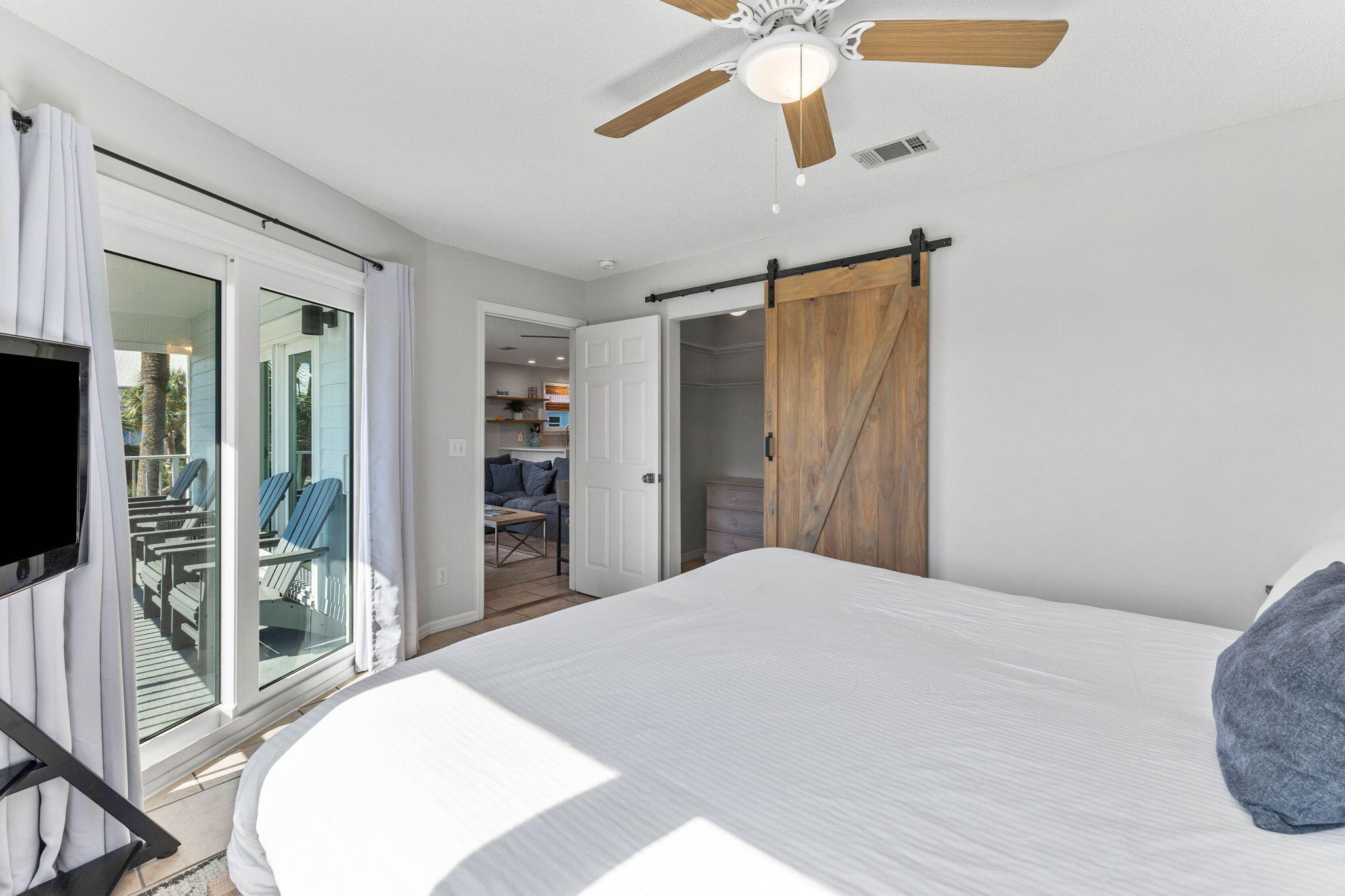 11 Beachside Drive, Unit 1121 Santa Rosa Beach, FL 32459 - Photo 20 of 43 a bedroom with a large bed and a flat screen tv