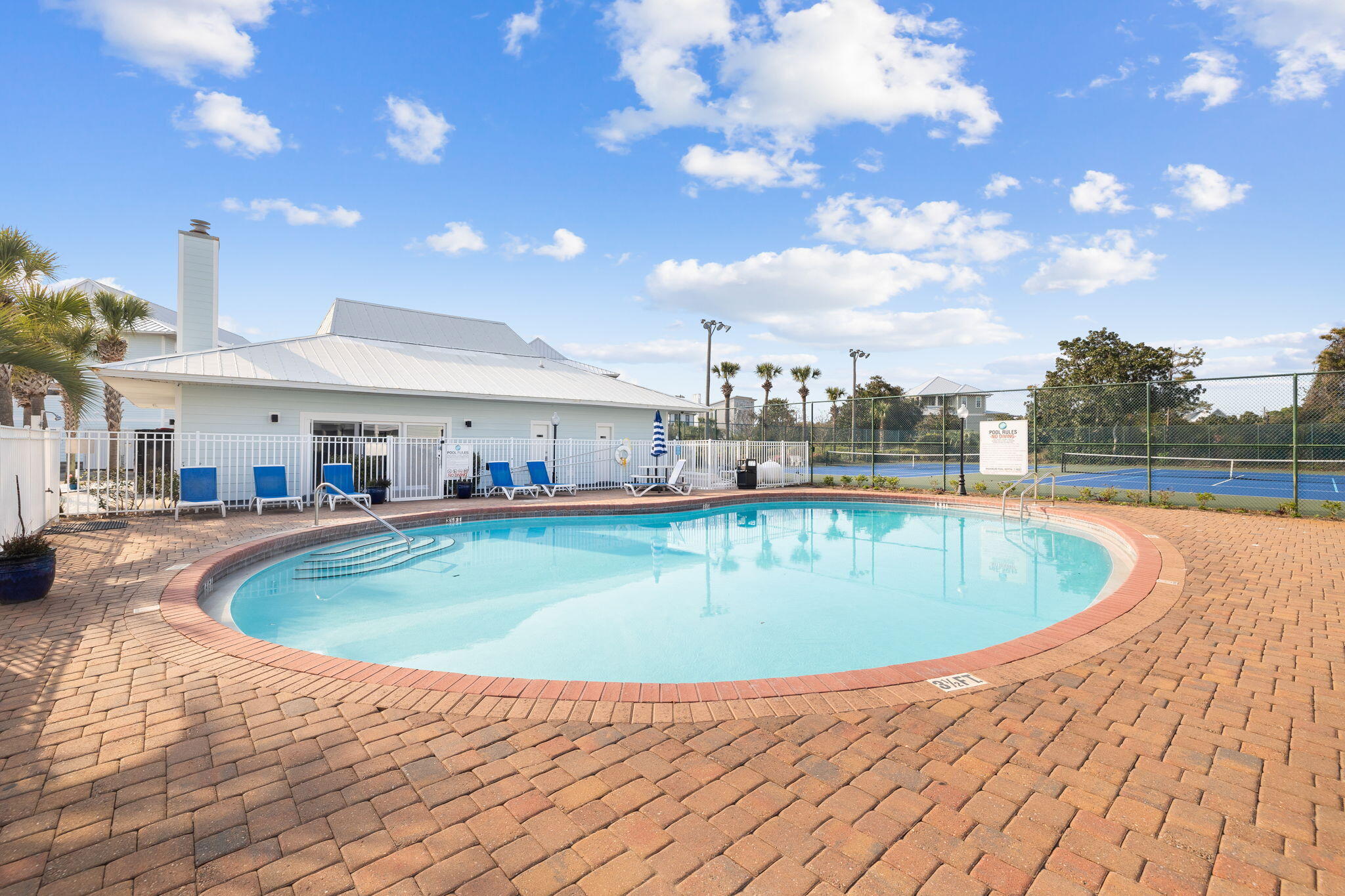 11 Beachside Drive, Unit 1121 Santa Rosa Beach, FL 32459 - Photo 37 of 43 a view of a swimming pool with a table and chairs