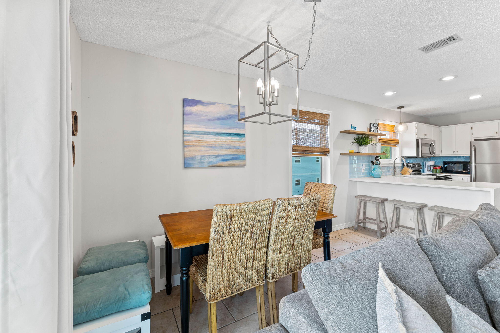 11 Beachside Drive, Unit 1121 Santa Rosa Beach, FL 32459 - Photo 7 of 43 a living room with kitchen island furniture and a chandelier