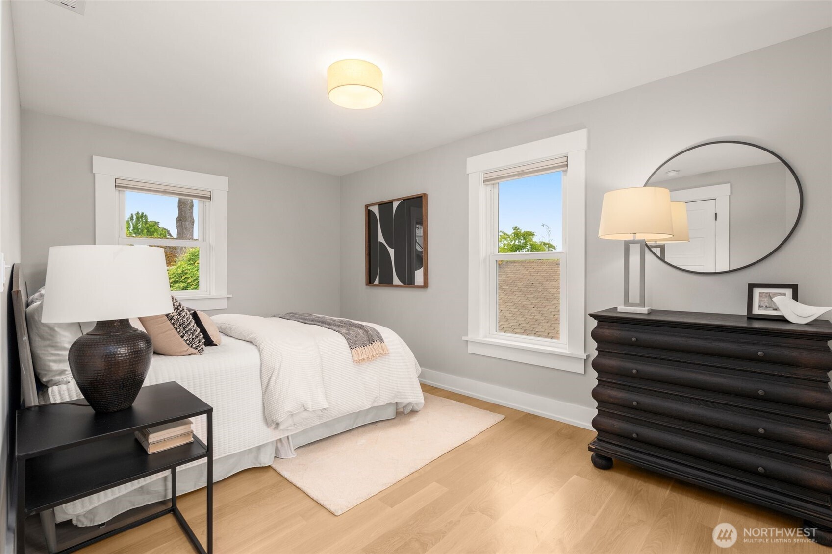 170 Lynn Street Seattle, WA 98109 - Photo 21 of 40 a bedroom with a bed chair and a window
