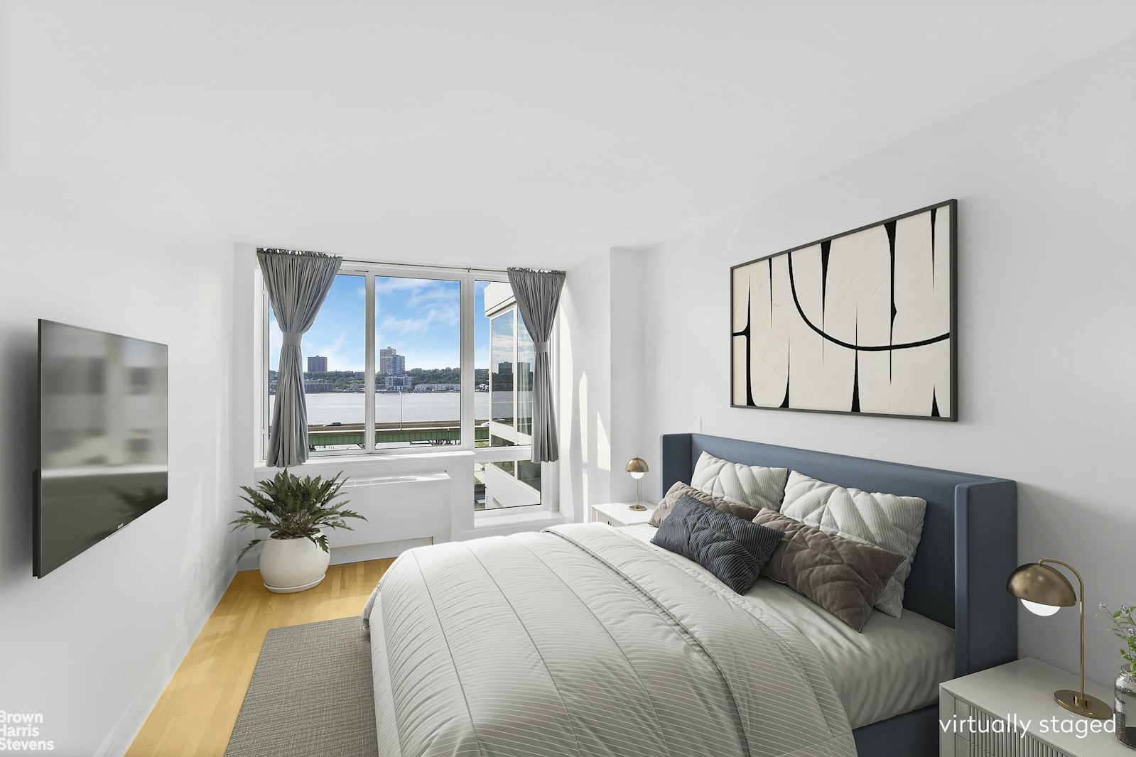 120 Riverside Boulevard, Unit 7H Manhattan, NY 10069 - Photo 2 of 6 a bedroom with a bed and a large window