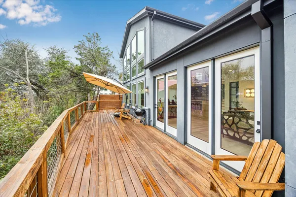 a aerial view of a house with a yard basket ball court and outdoor seating