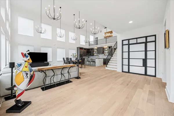 a view of a livingroom with furniture and hardwood floor