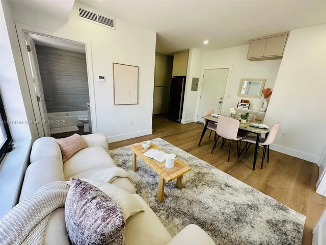 a living room with furniture and a rug