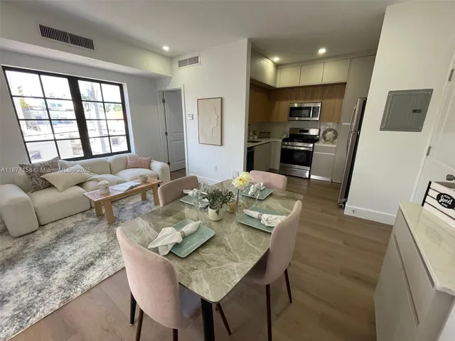 a view of a dining room with furniture