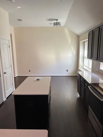 a view of kitchen with wooden floor